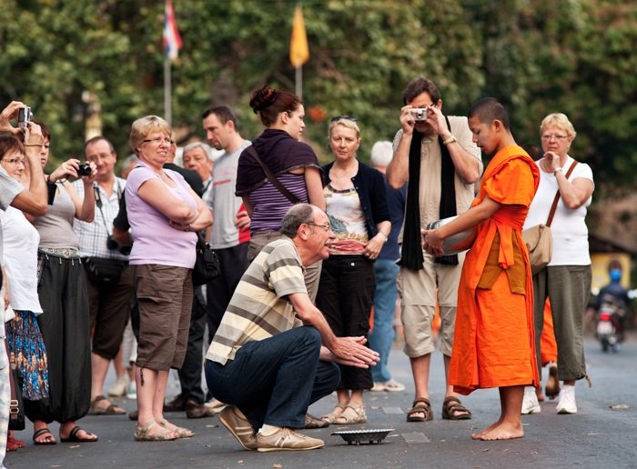 tourists photographing monks in Chiang Mai