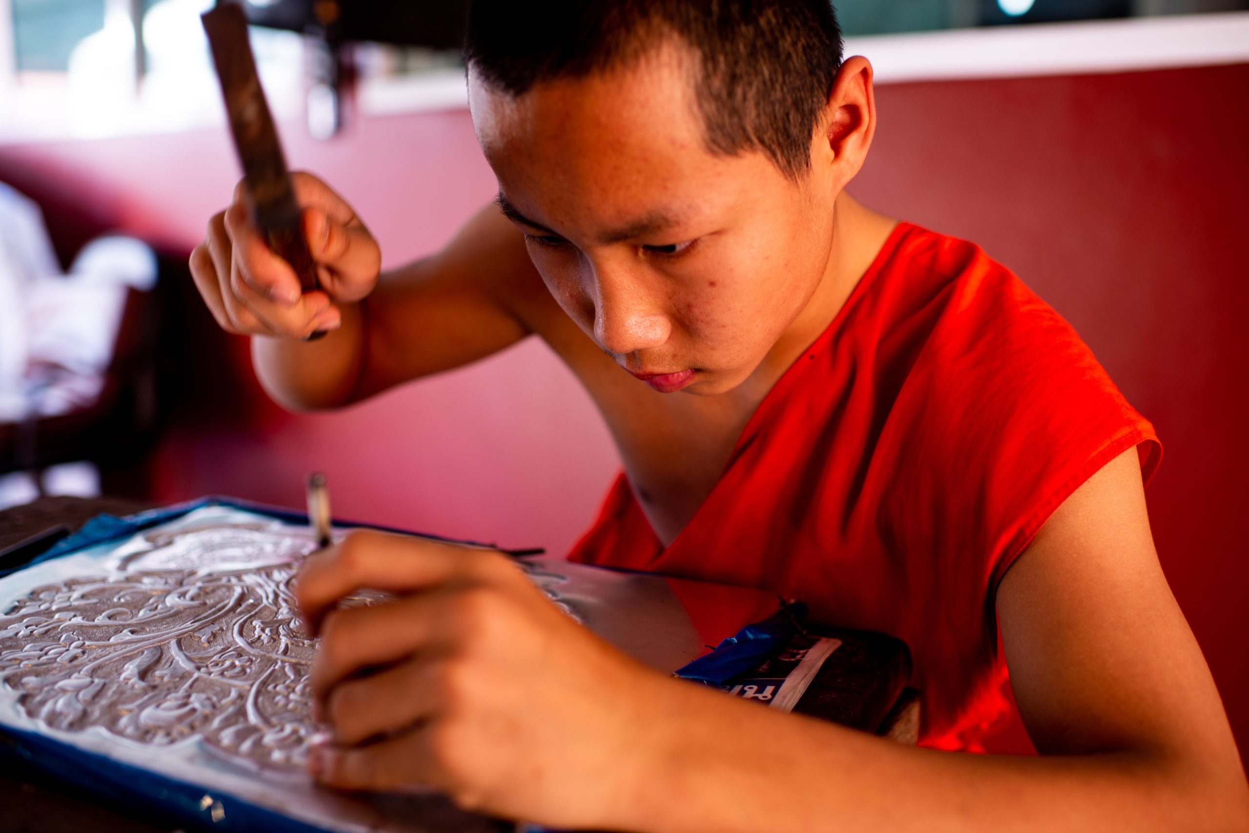 Young Buddhist monk making art © Kevin Landwer-Johan