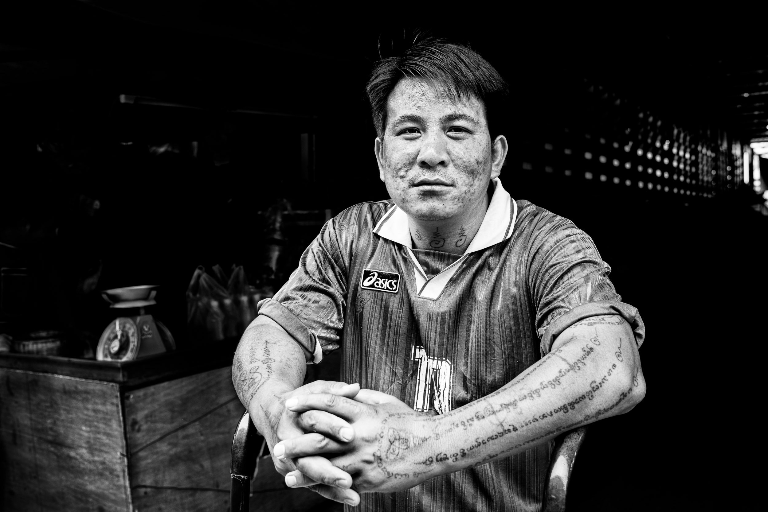 Black and white portrait of a market porter for Street Photography in Chiang Mai, © Kevin Landwer-Johan